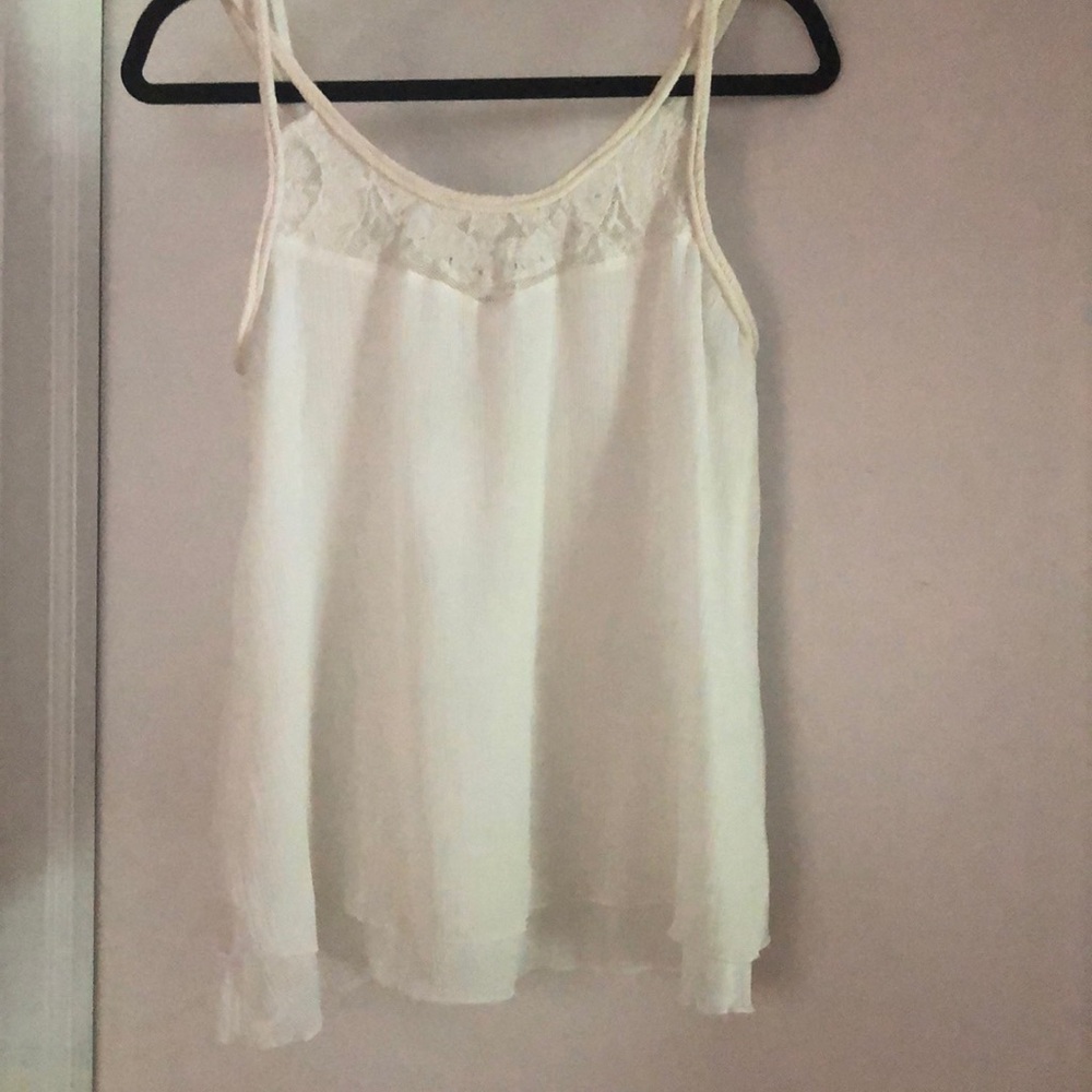 Lovely, cream tank with criss cross straps!